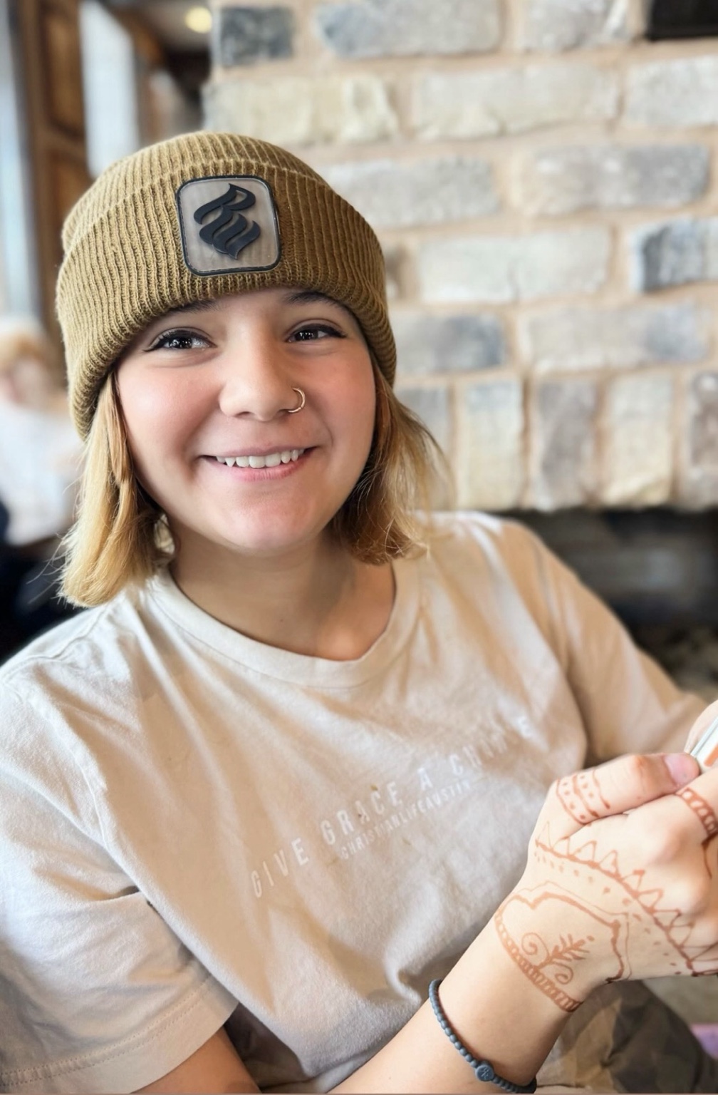 Arrow smiling in a beanie