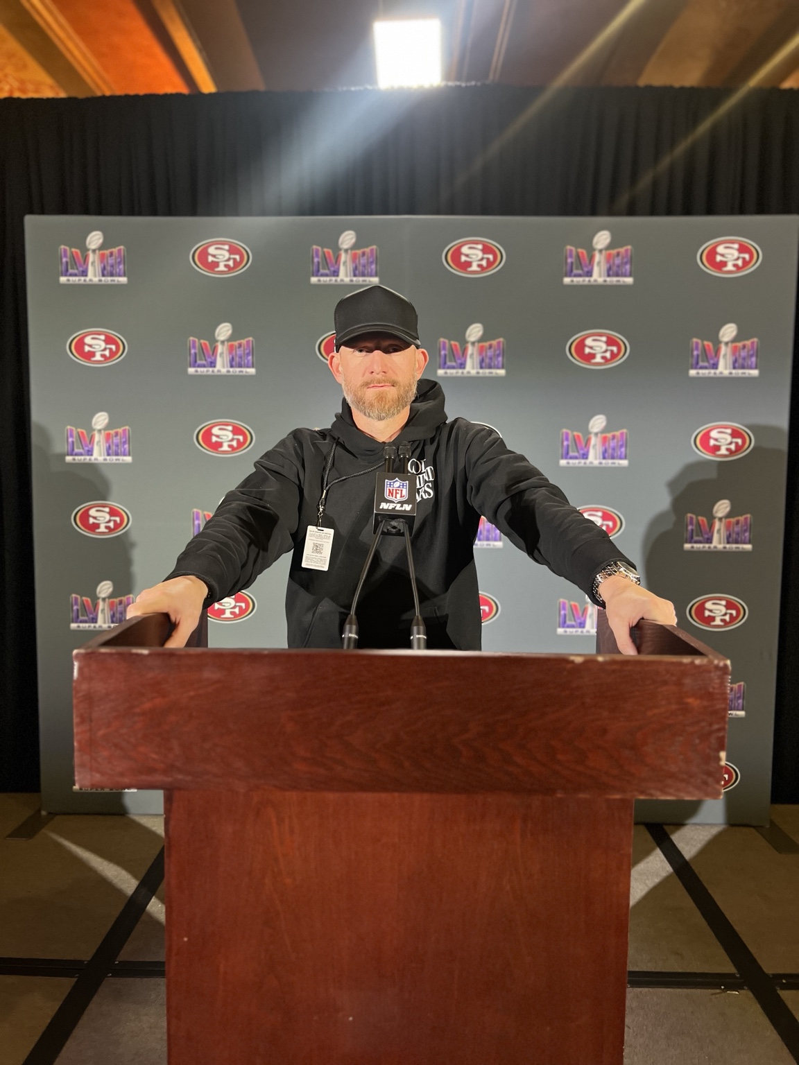 Justin at a 49ers podium during the Super Bowl press conference in Las Vegas