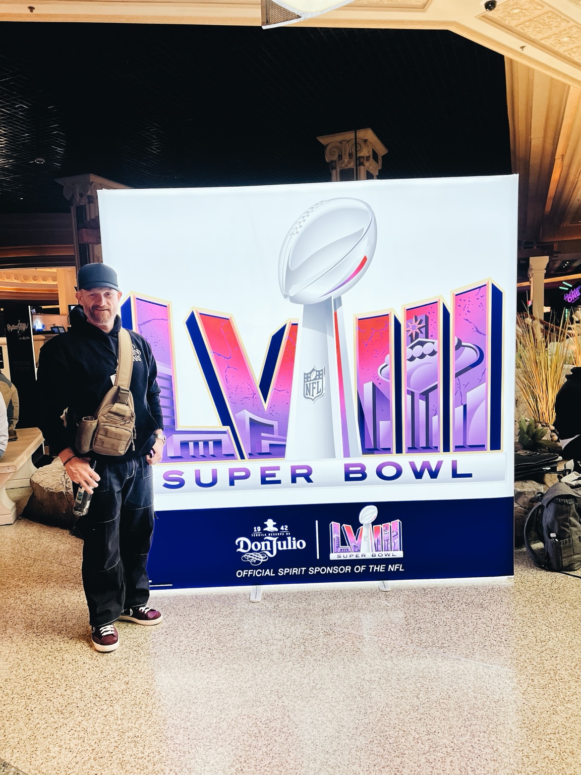 Justin Howard beside the Super Bowl LVIII sign in Las Vegas