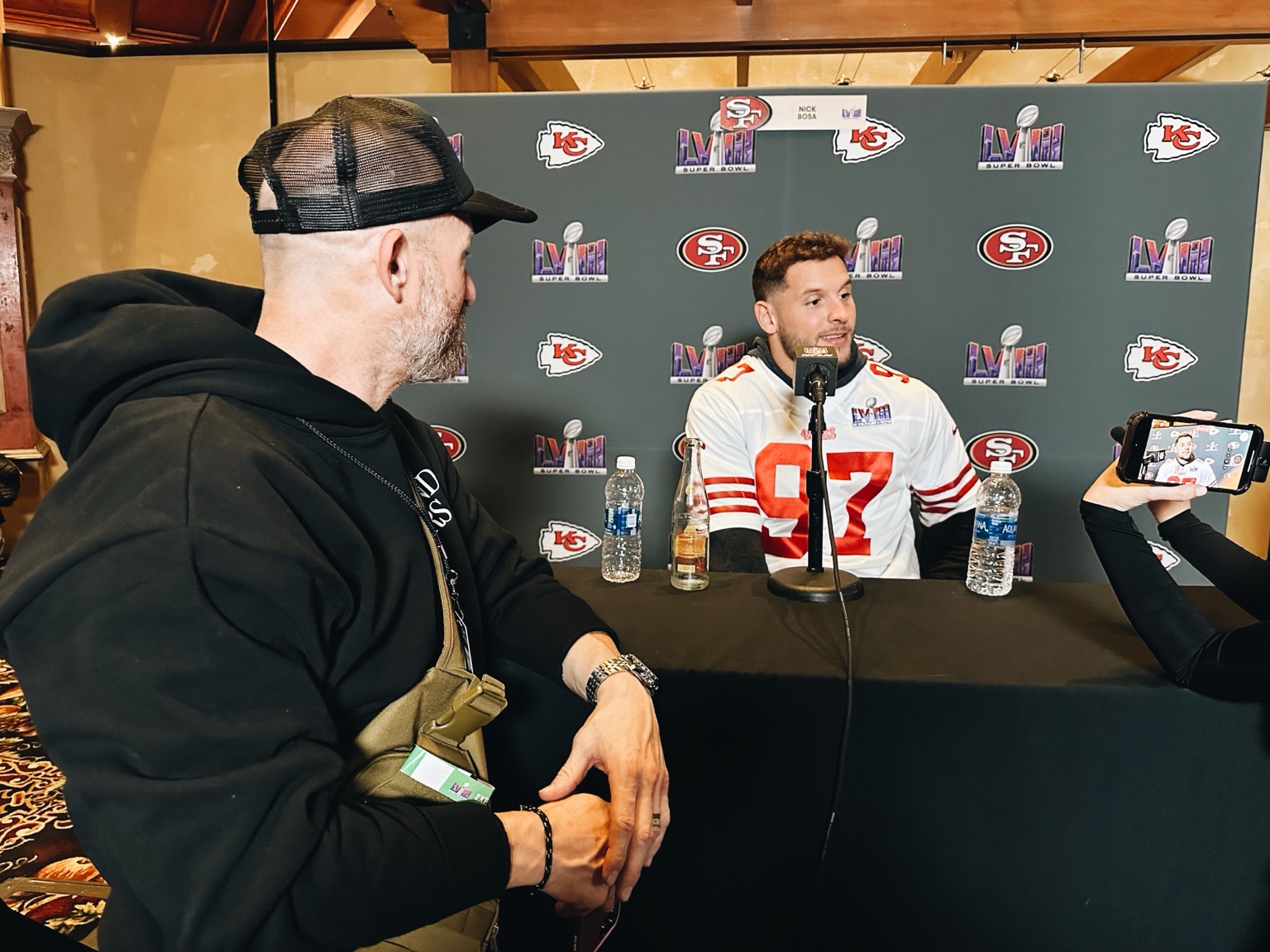 A wider view of Justin Howard interviewing Nick Bosa at Super Bowl LVIII