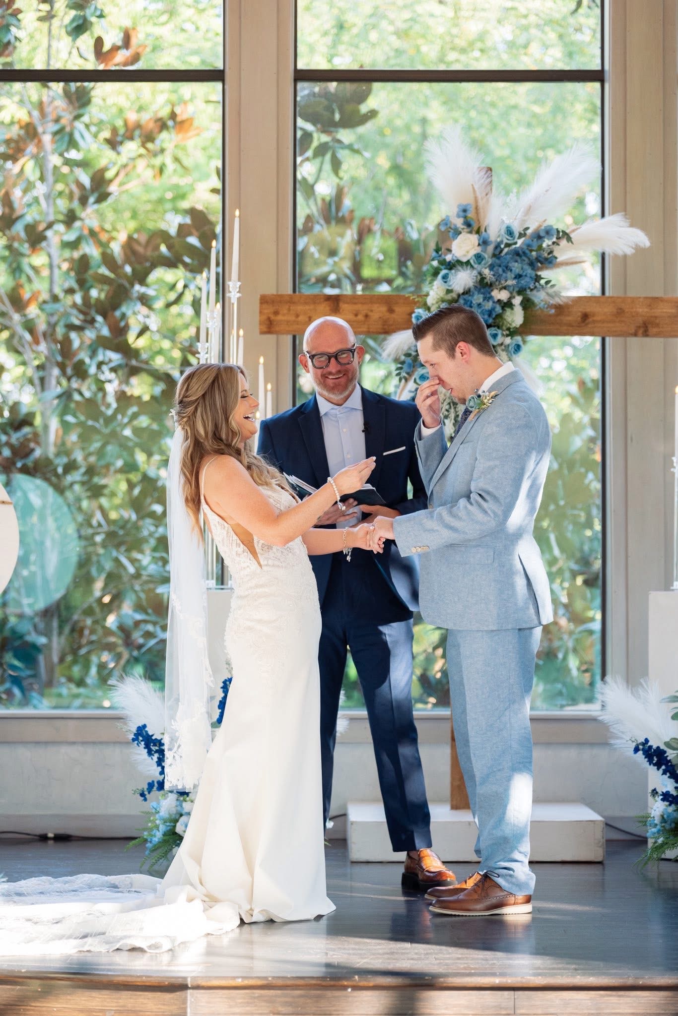 Justin Howard praying over a couple during their wedding ceremony