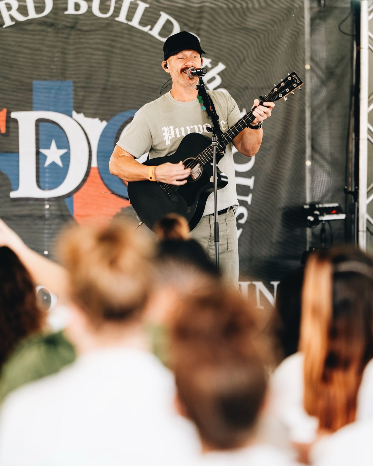 Justin leading acoustic worship on stage