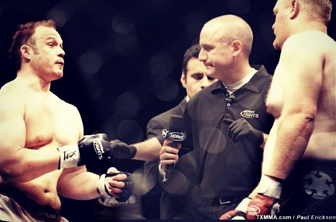 Justin facing an opponent before an MMA fight